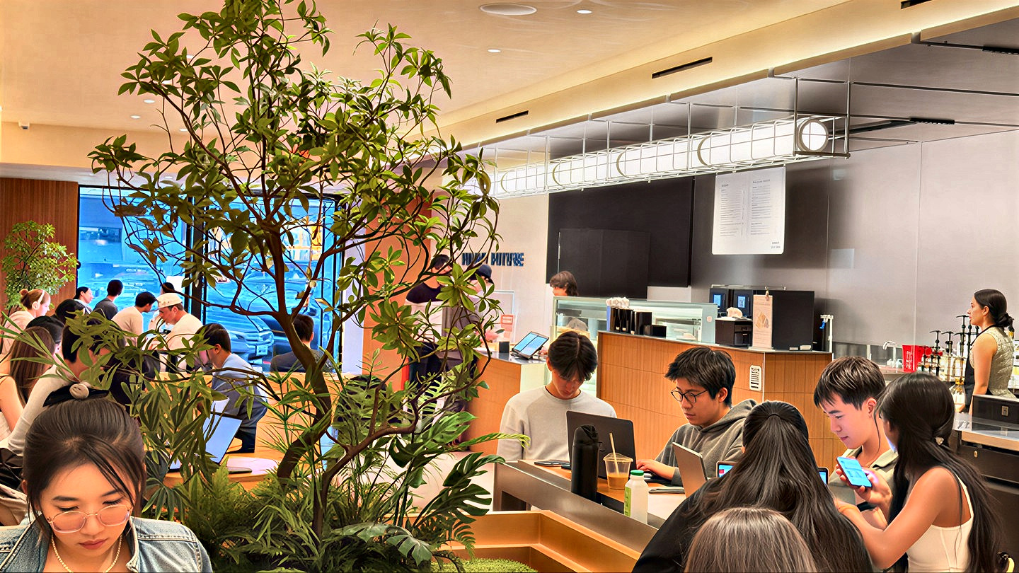 People working on laptops in a Yummy Future shop