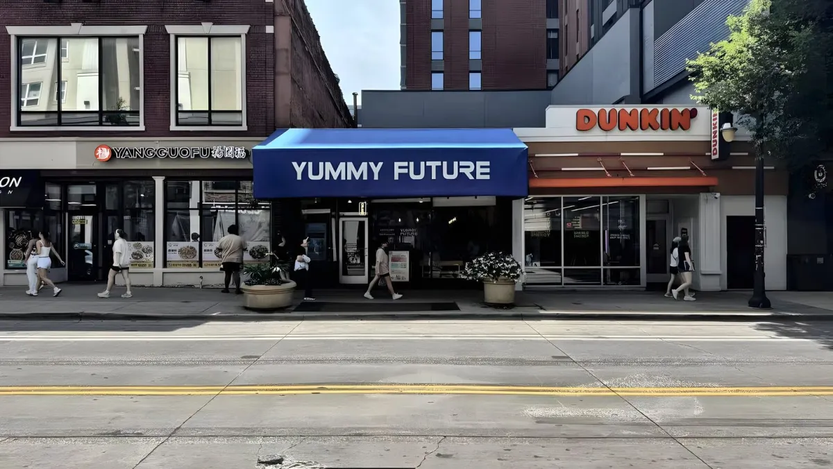 Yummy Future storefront with the blue awning at 609 E Green St, Champaign
