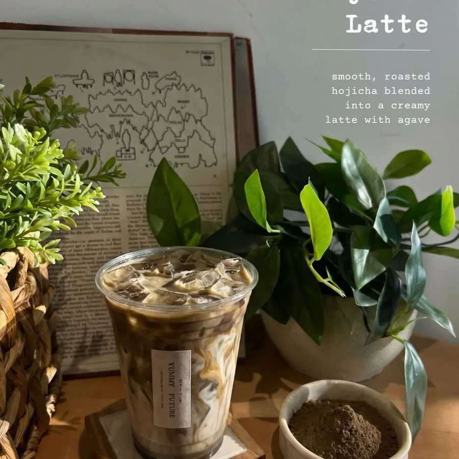 Instagram post: Iced Hojicha Latte in front of an old map print, hojicha powder in a dish