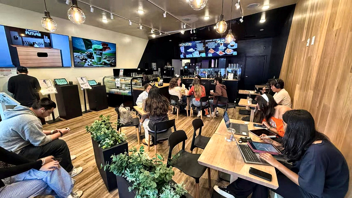 Champaign store interior, a group at tables studying and hanging out