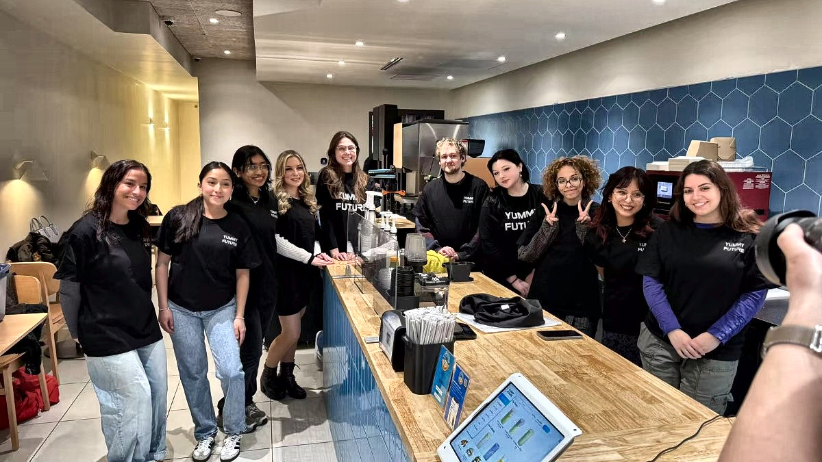 The Yummy Future team lined up behind the counter